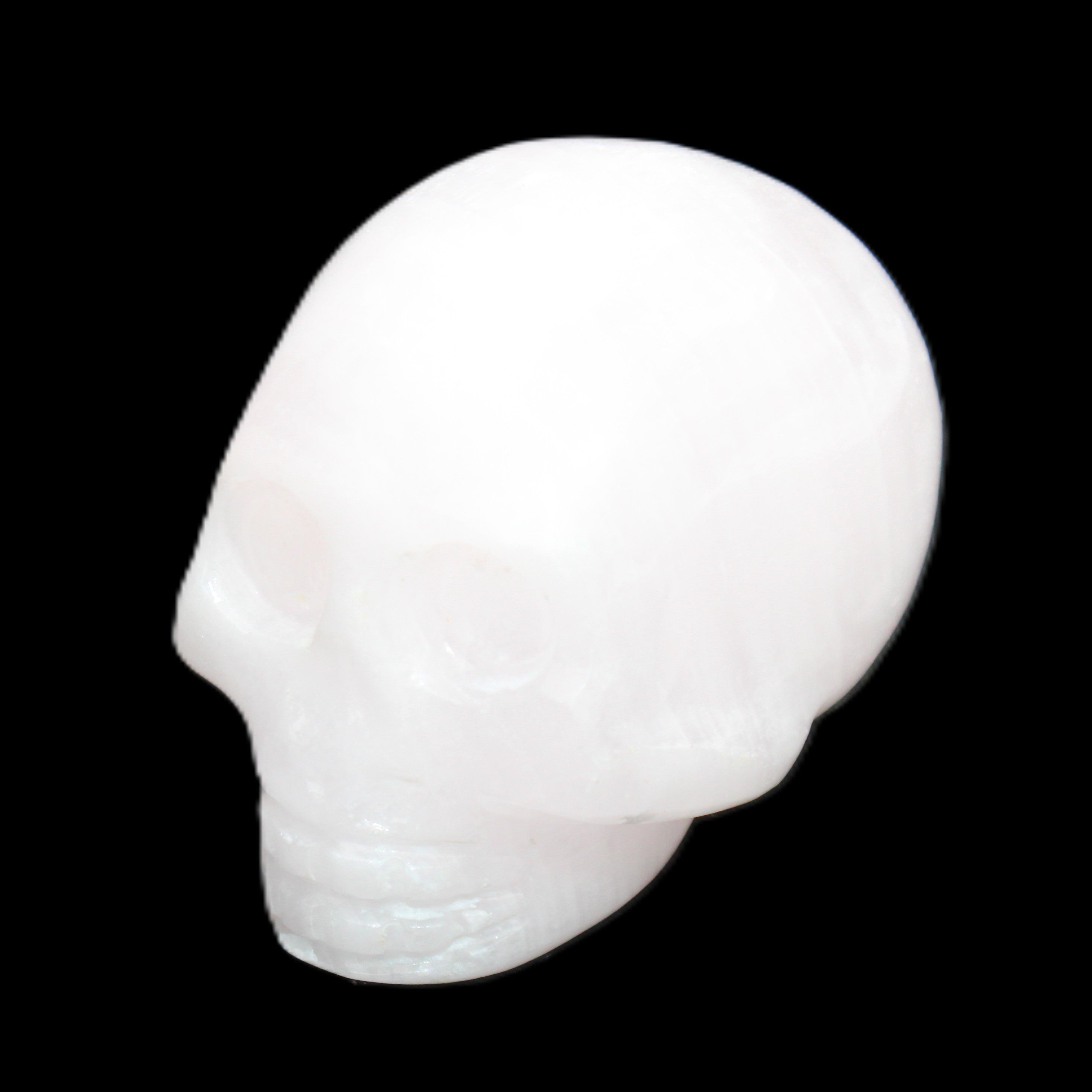 Mangano Calcite skull 30*45*38mm 78g in sunlight - Rocks and Things Store