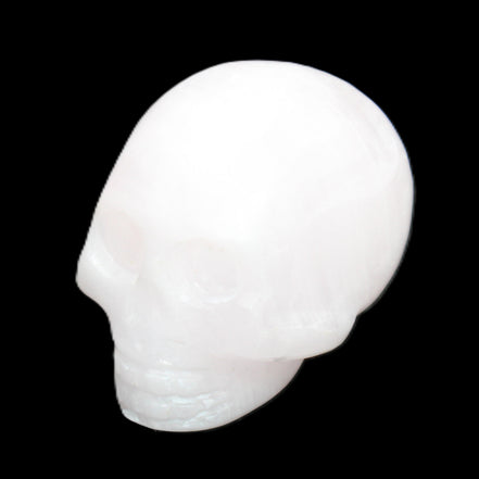 Mangano Calcite skull 30*45*38mm 78g in sunlight - Rocks and Things Store