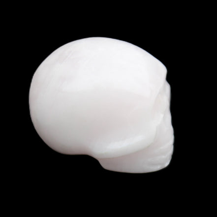 Mangano Calcite skull 30*45*38mm 78g in sunlight - Rocks and Things Store