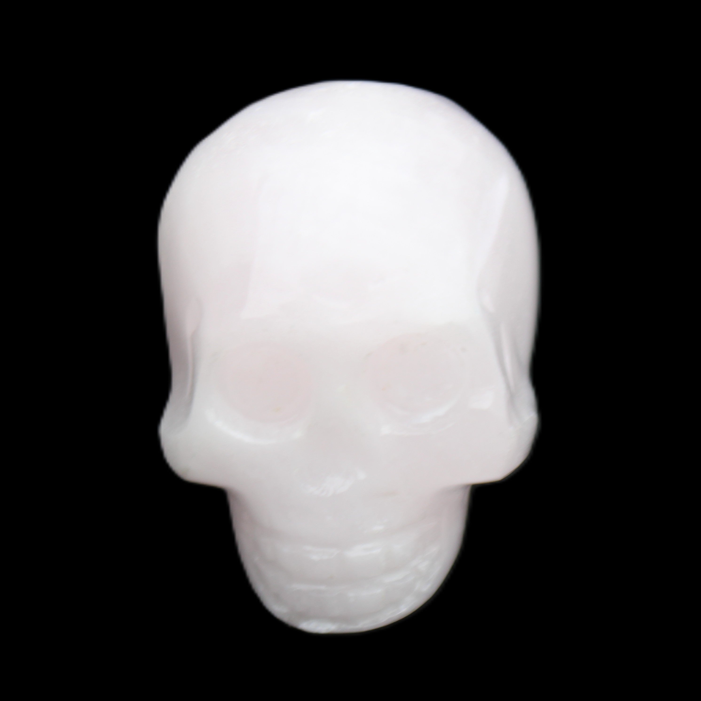Mangano Calcite skull 30*45*38mm 78g in sunlight - Rocks and Things Store