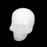 Mangano Calcite skull 30*45*38mm 78g in sunlight - Rocks and Things Store
