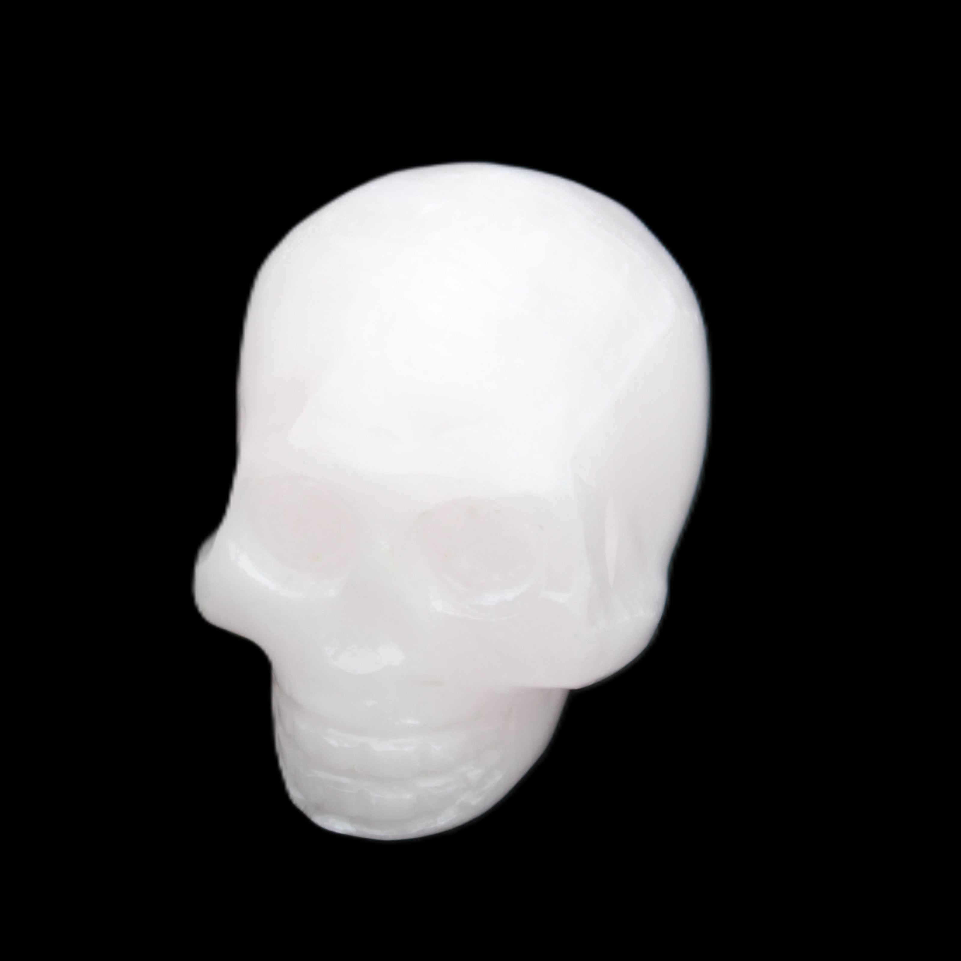 Mangano Calcite skull 30*45*38mm 78g in sunlight - Rocks and Things Store