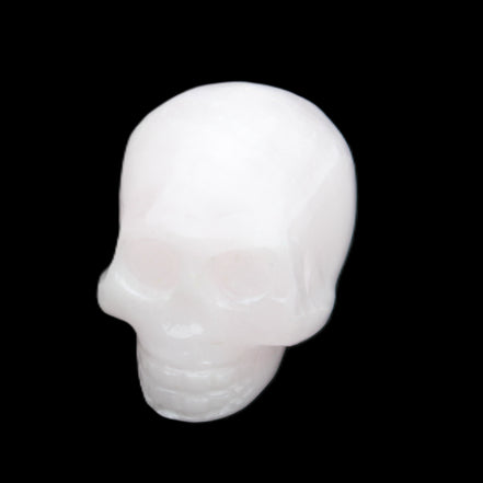 Mangano Calcite skull 30*45*38mm 78g in sunlight - Rocks and Things Store