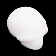 Mangano Calcite skull 30*45*38mm 78g in sunlight - Rocks and Things Store