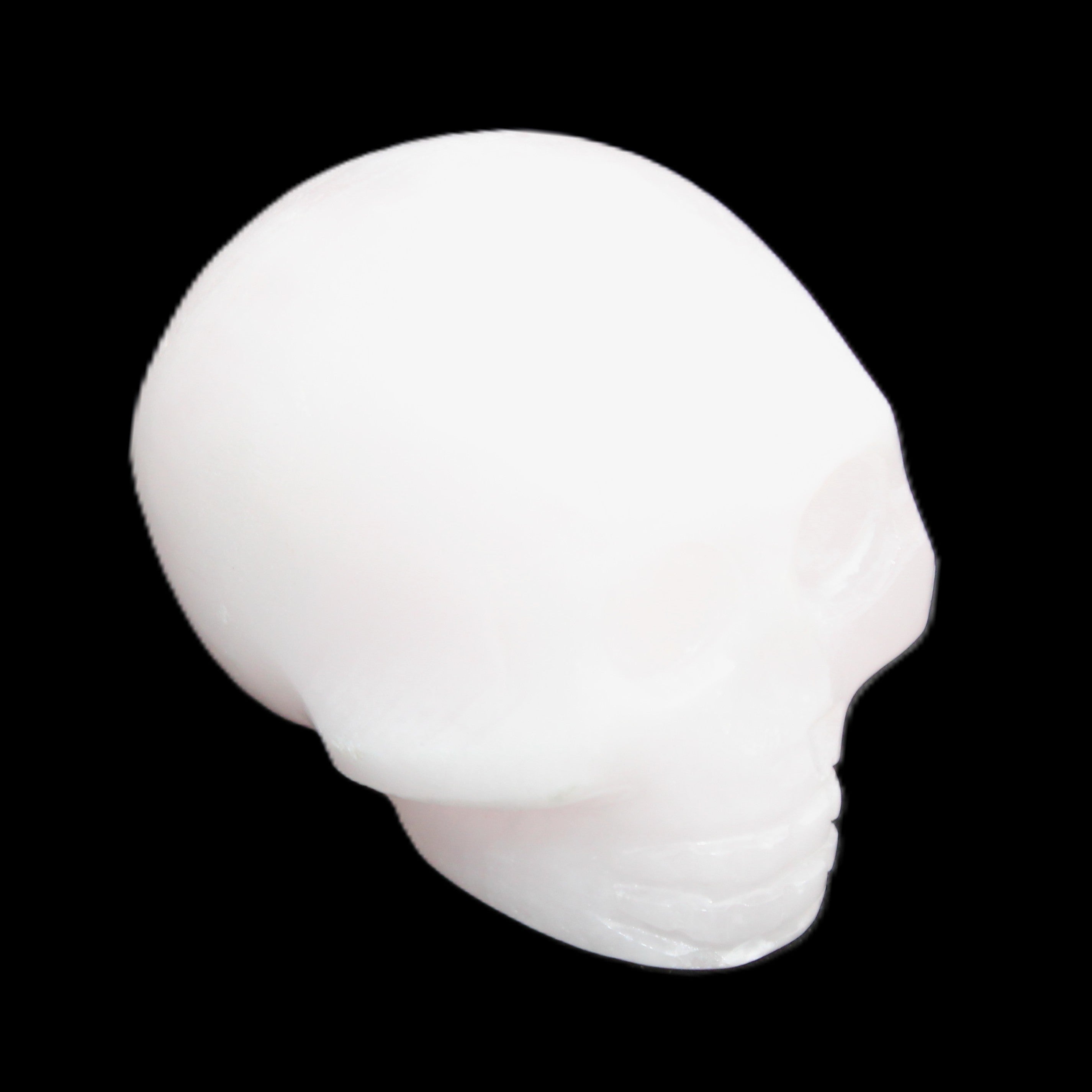 Mangano Calcite skull 30*45*38mm 78g in sunlight - Rocks and Things Store