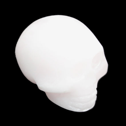 Mangano Calcite skull 30*45*38mm 78g in sunlight - Rocks and Things Store