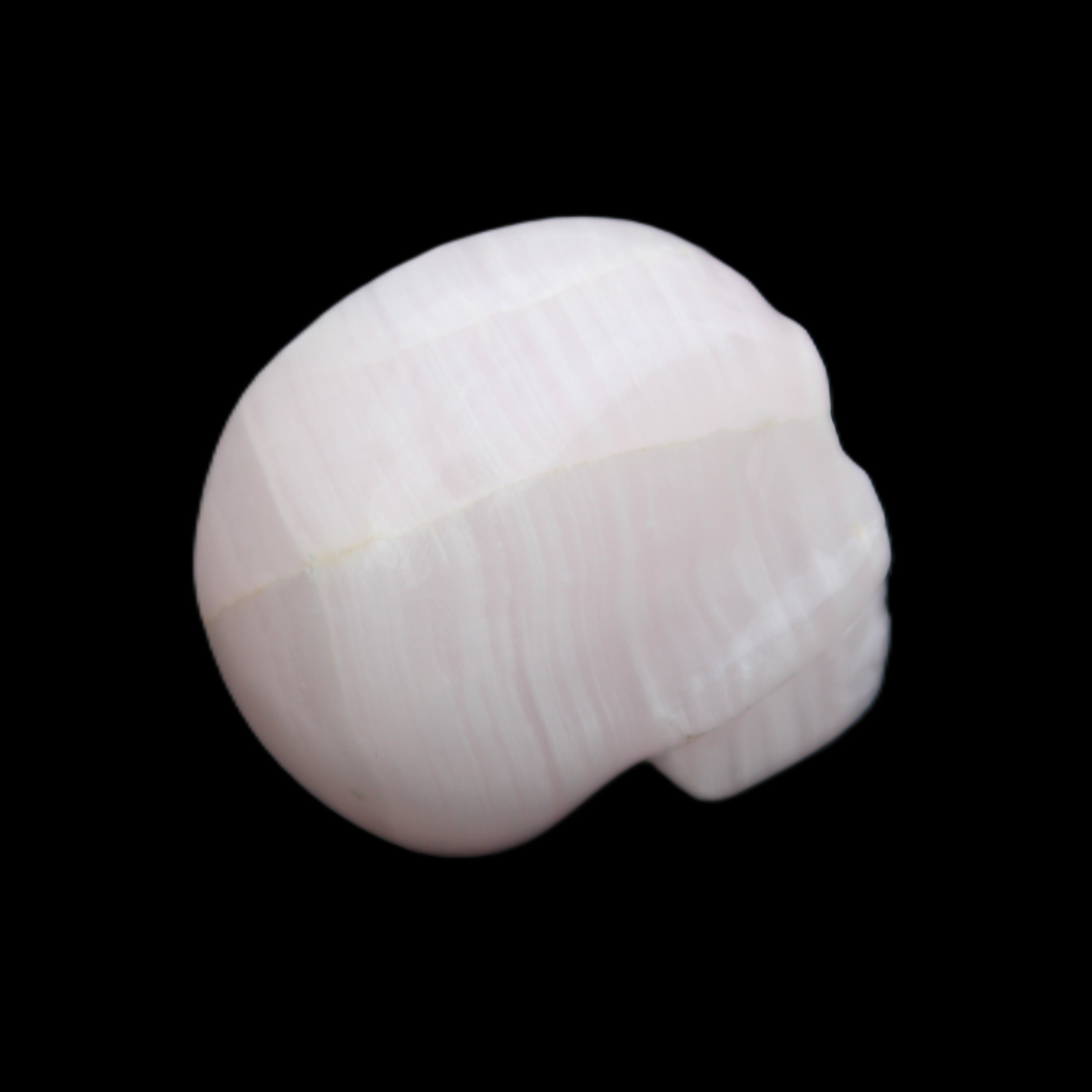 Mangano Calcite skull 30*42*35mm 83g in sunlight - Rocks and Things Store
