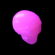 Mangano Calcite skull 30*42*35mm 83g in UV light - Rocks and Things Store