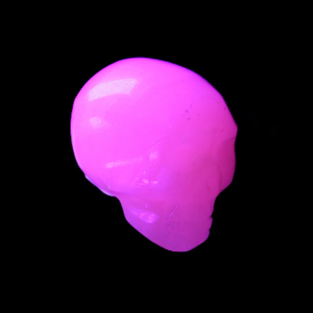 Mangano Calcite skull 30*42*35mm 83g in UV light - Rocks and Things Store