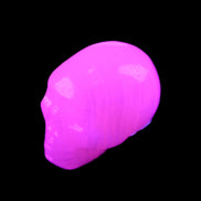 Mangano Calcite skull 30*42*35mm 83g in UV light - Rocks and Things Store