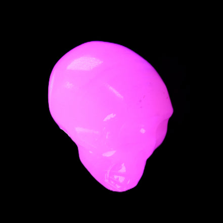 Mangano Calcite skull 30*42*35mm 83g in UV light - Rocks and Things Store