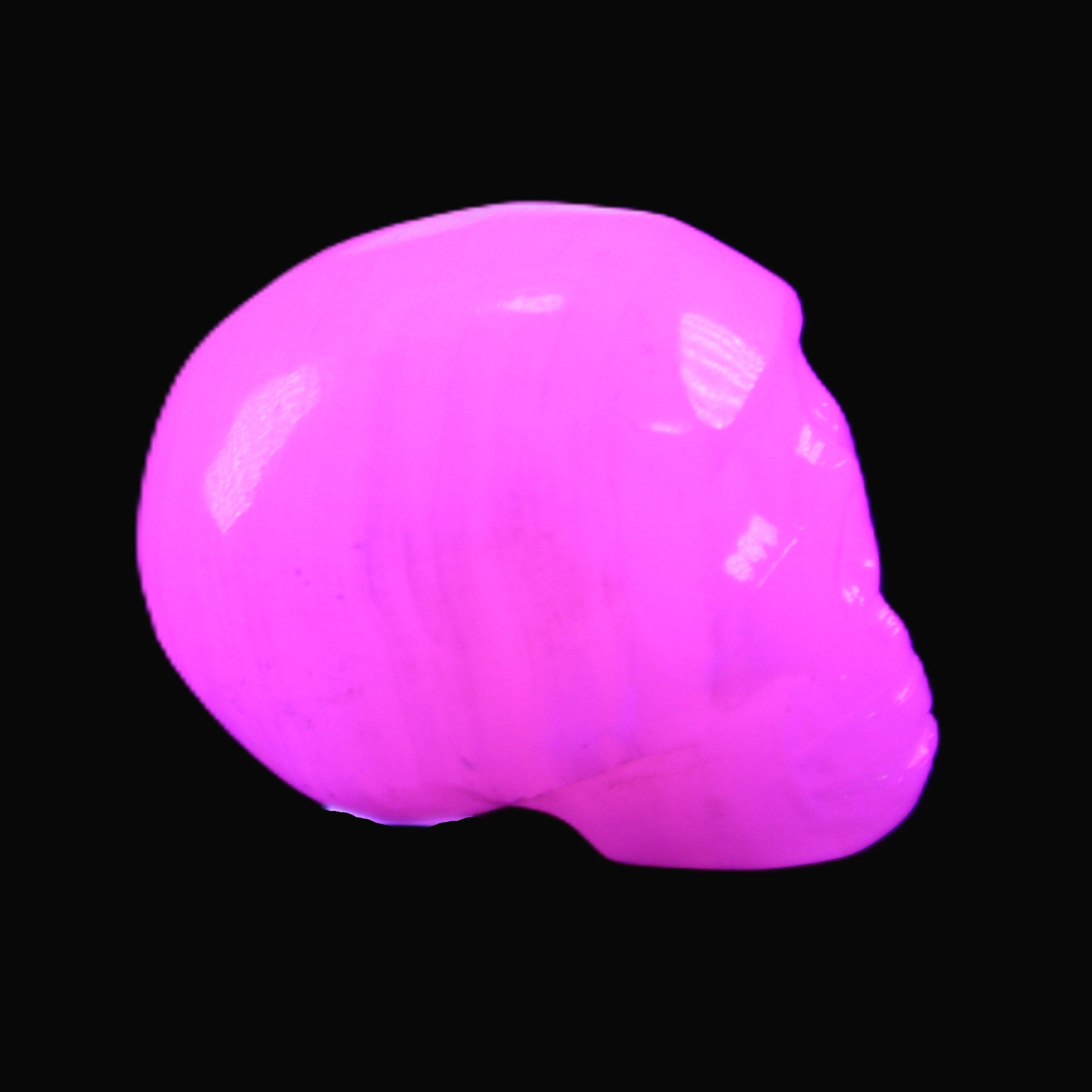 Mangano Calcite skull 30*42*35mm 83g in UV light - Rocks and Things Store