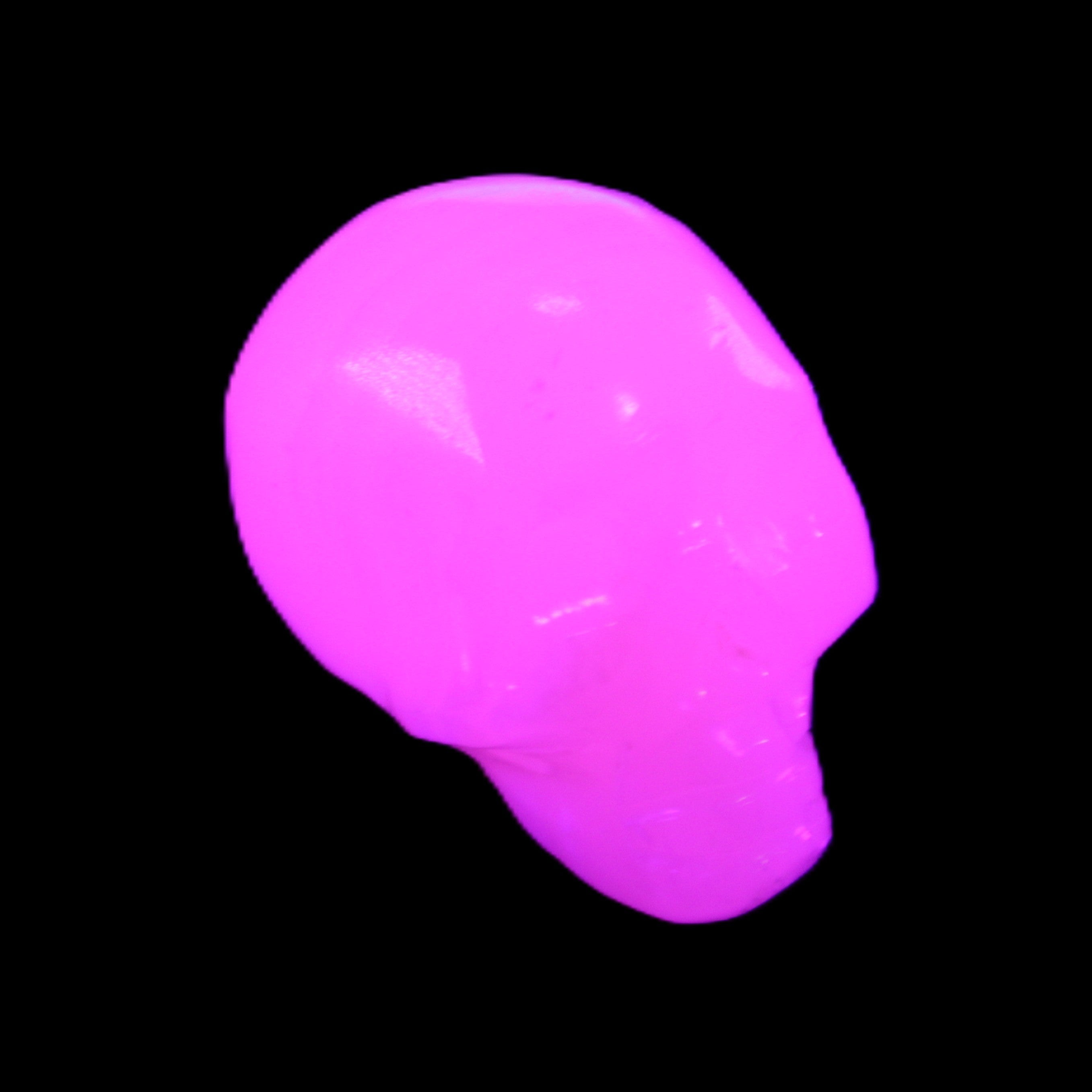 Mangano Calcite skull 30*42*35mm 83g in UV light - Rocks and Things Store