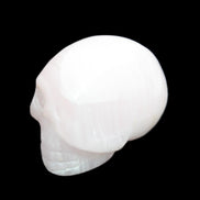 Mangano Calcite skull 30*42*35mm 83g in sunlight - Rocks and Things Store