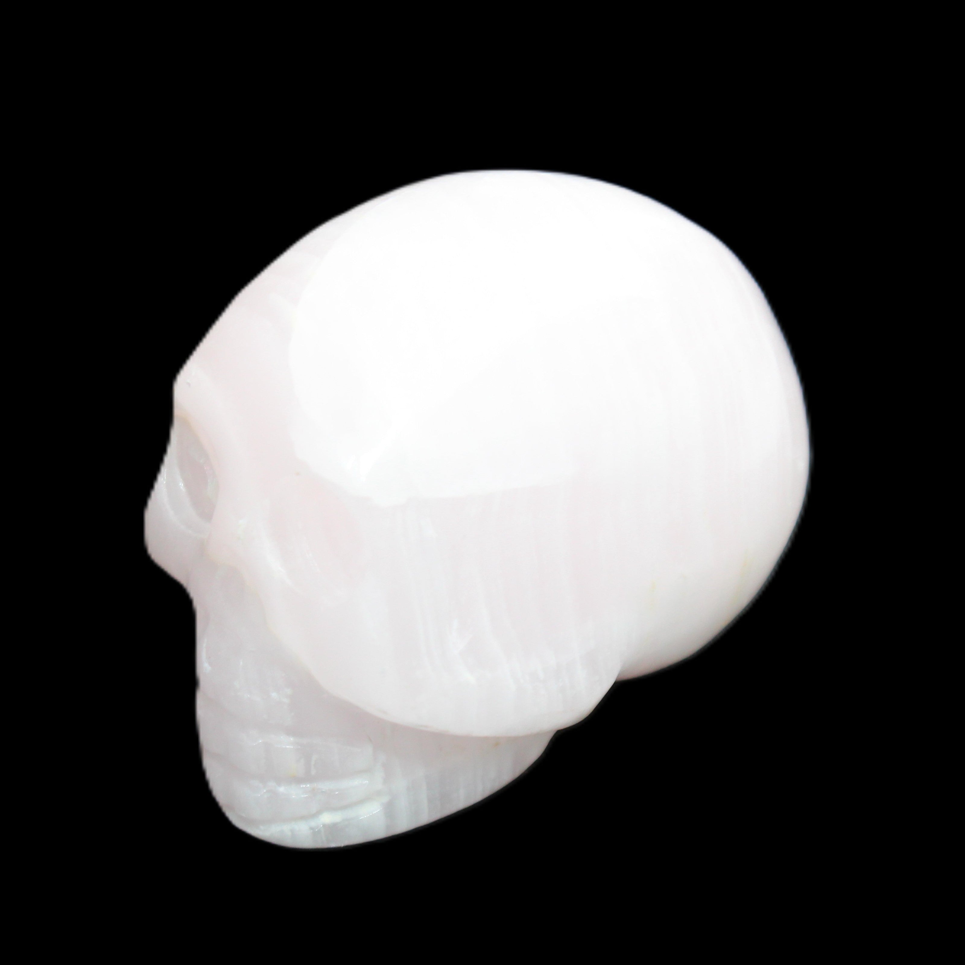 Mangano Calcite skull 30*42*35mm 83g in sunlight - Rocks and Things Store