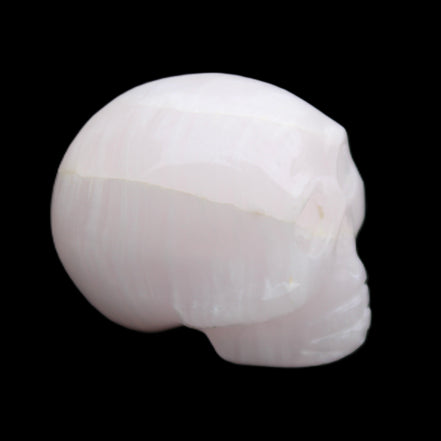 Mangano Calcite skull 30*42*35mm 83g in sunlight - Rocks and Things Store