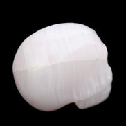 Mangano Calcite skull 30*42*35mm 83g in sunlight - Rocks and Things Store