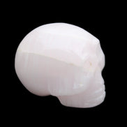 Mangano Calcite skull 30*42*35mm 83g in sunlight - Rocks and Things Store