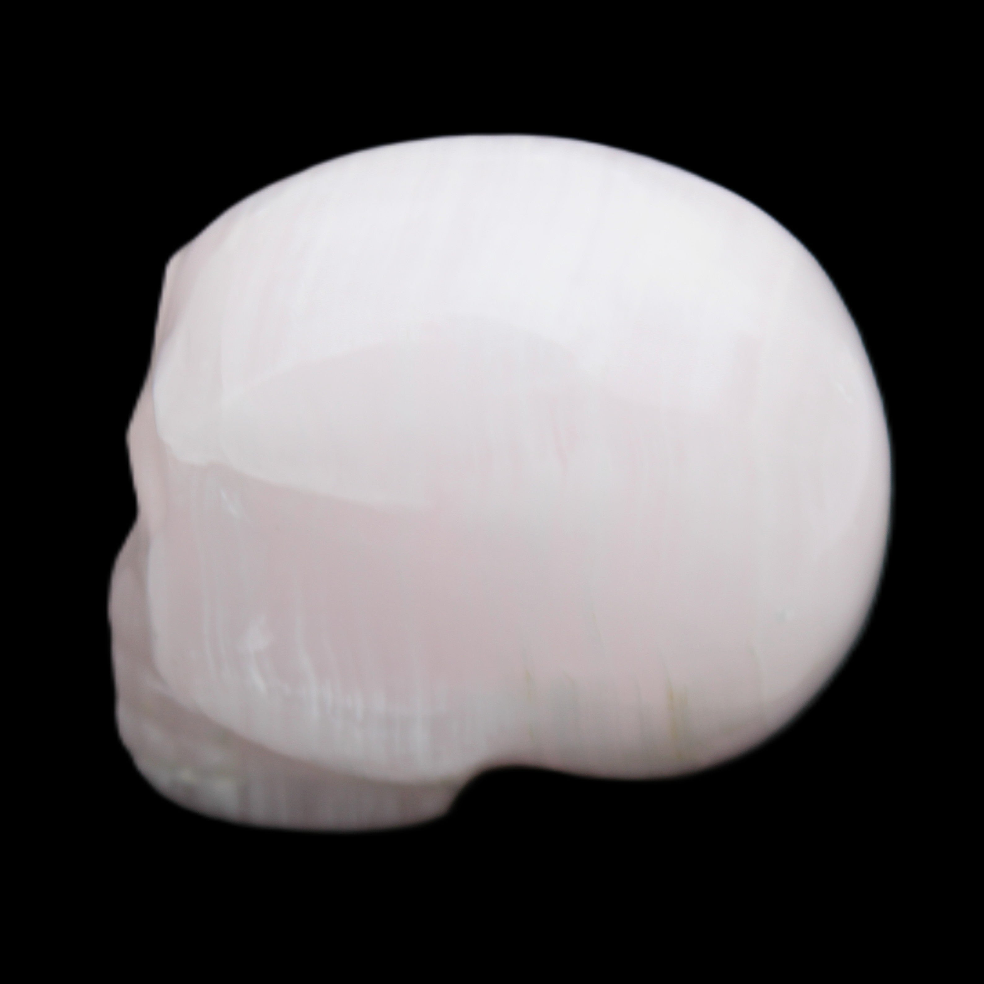 Mangano Calcite skull 30*42*35mm 83g in sunlight - Rocks and Things Store