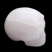 Mangano Calcite skull 30*42*35mm 83g in sunlight - Rocks and Things Store