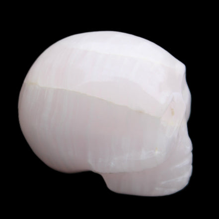 Mangano Calcite skull 30*42*35mm 83g in sunlight - Rocks and Things Store
