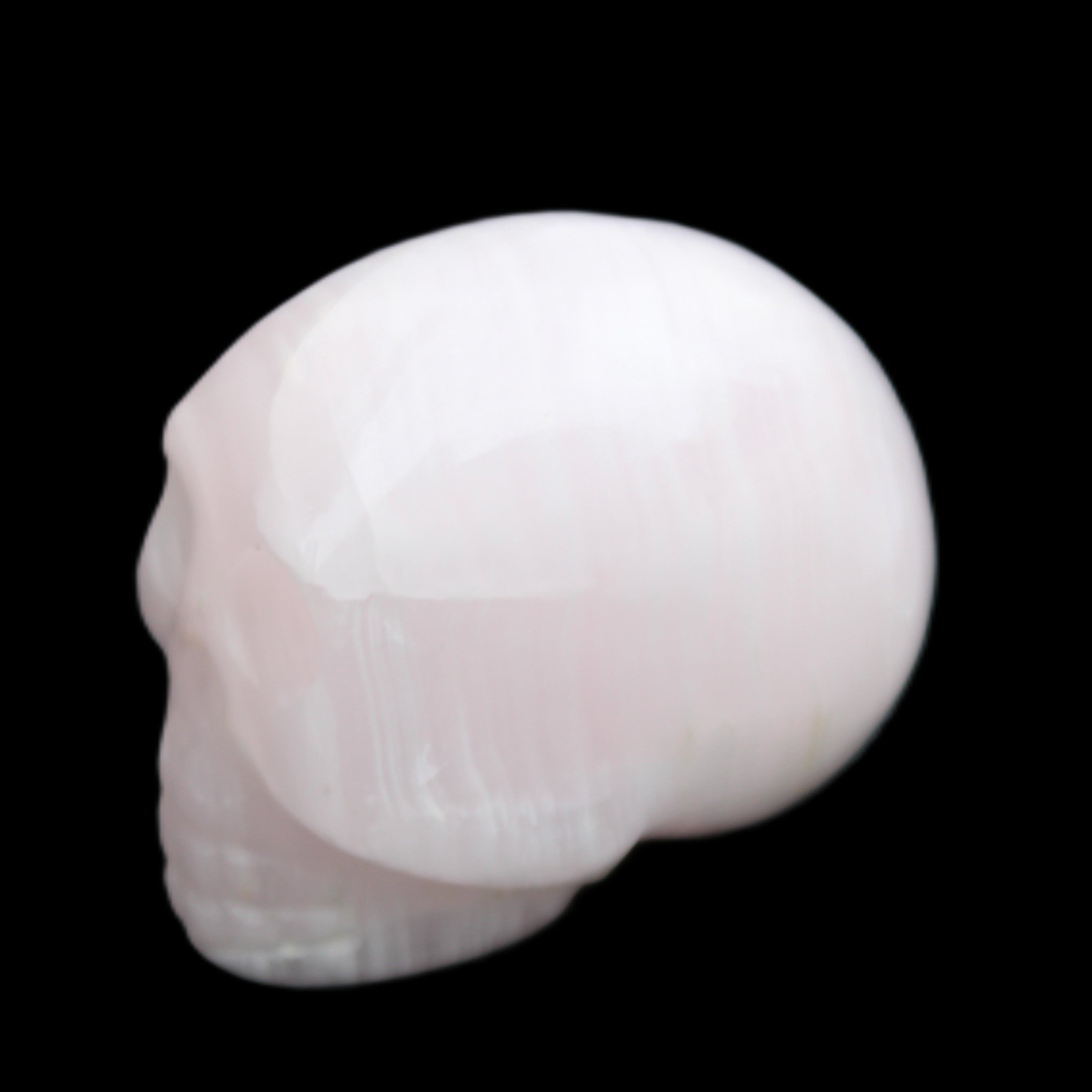 Mangano Calcite skull 30*42*35mm 83g in sunlight - Rocks and Things Store