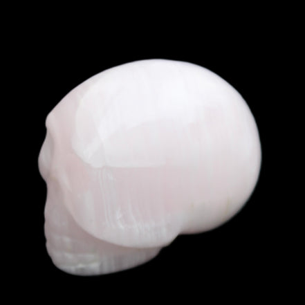 Mangano Calcite skull 30*42*35mm 83g in sunlight - Rocks and Things Store