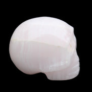 Mangano Calcite skull 30*42*35mm 83g in sunlight - Rocks and Things Store