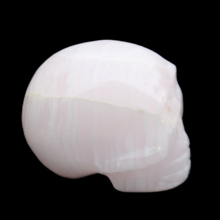 Mangano Calcite skull 30*42*35mm 83g in sunlight - Rocks and Things Store