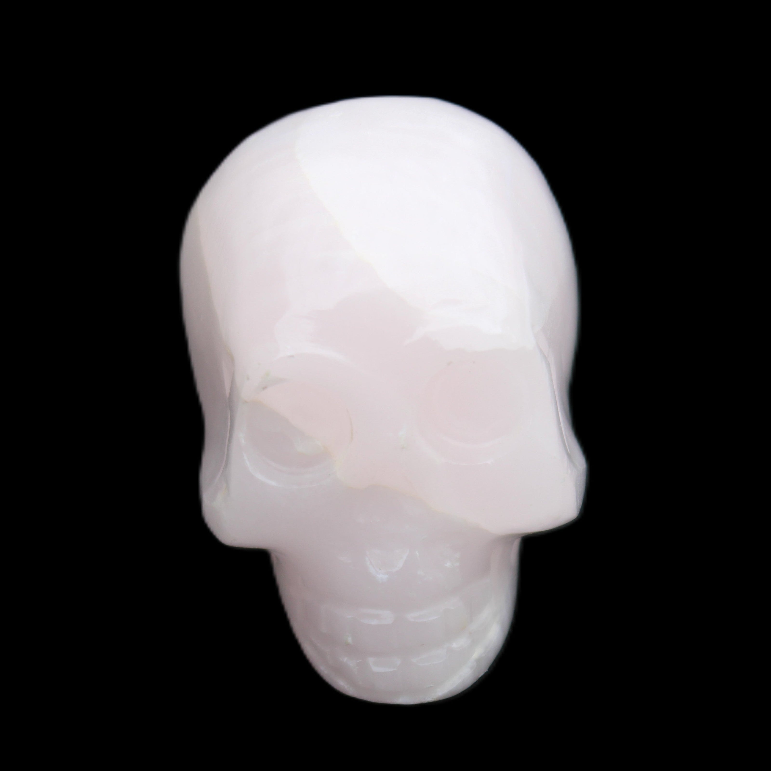 Mangano Calcite skull 30*42*35mm 83g in sunlight - Rocks and Things Store