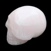 Mangano Calcite skull 30*42*35mm 83g in sunlight - Rocks and Things Store