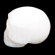 Mangano Calcite skull 30*42*35mm 83g in sunlight - Rocks and Things Store