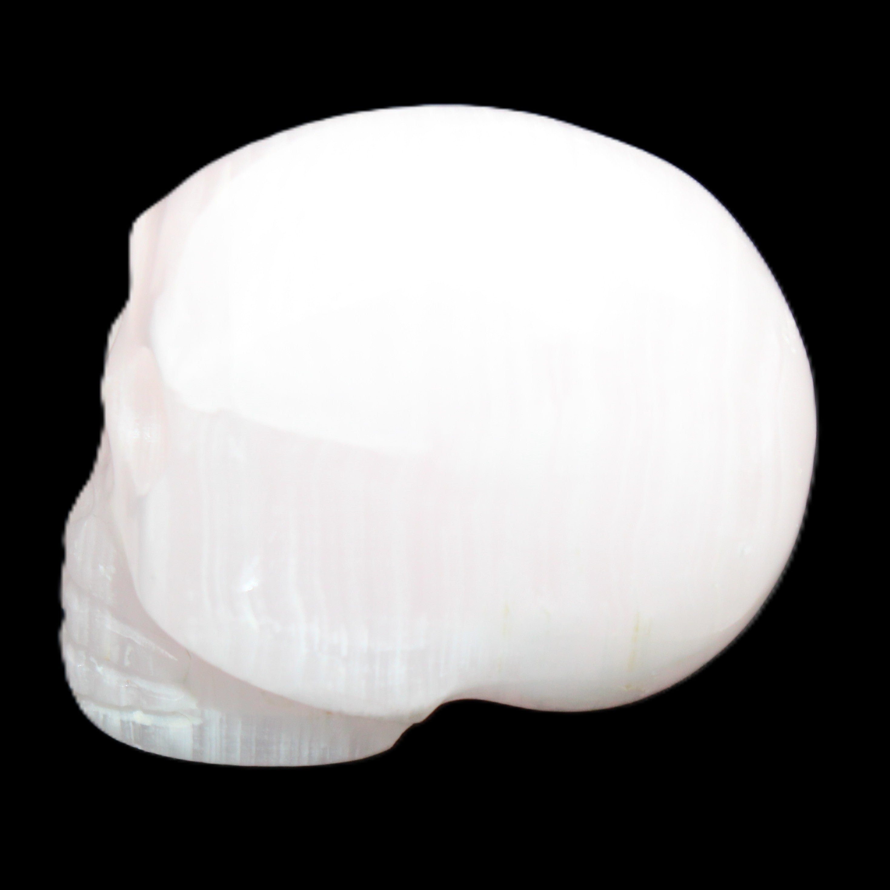 Mangano Calcite skull 30*42*35mm 83g in sunlight - Rocks and Things Store