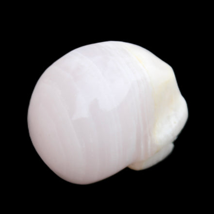 Mangano Calcite skull 30*42*35mm 83g in sunlight - Rocks and Things Store