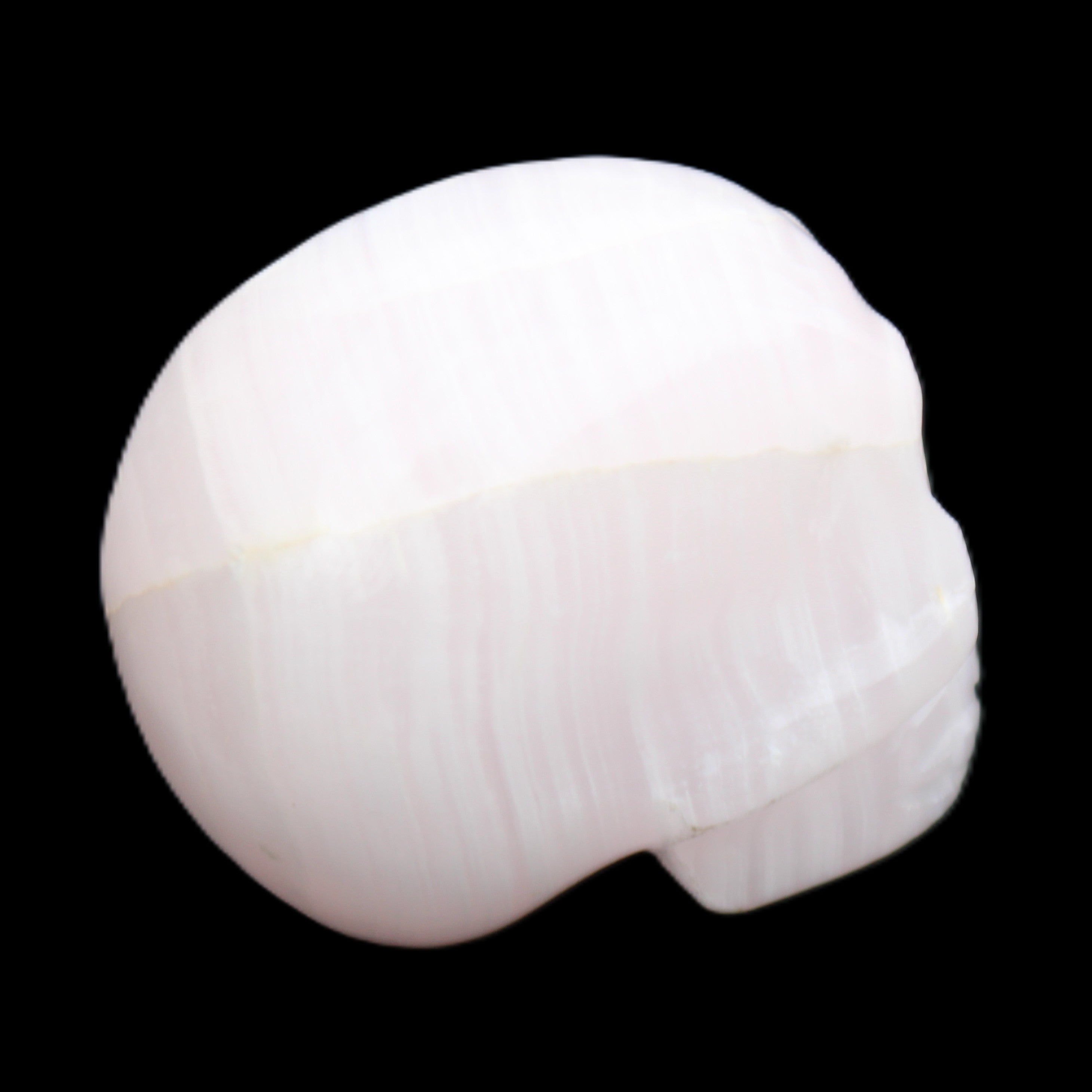 Mangano Calcite skull 30*42*35mm 83g in sunlight - Rocks and Things Store