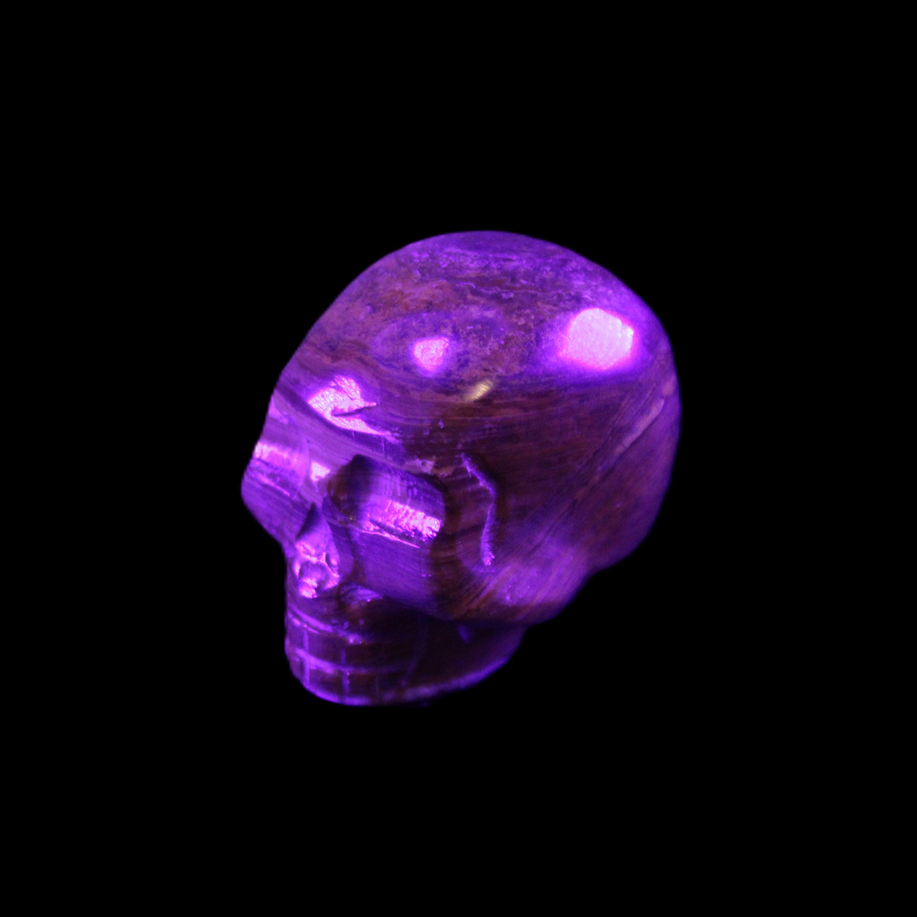 BumbleBee Banded Calcite skull 35*47*39mm 112g in UV light - Rocks and Things Store