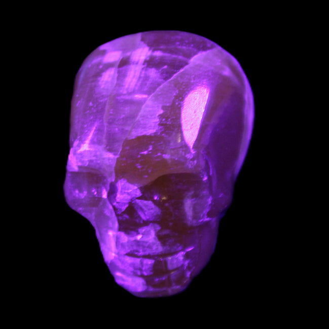Honey Calcite skull from Pakistan 28*44*36mm 93g in UV light - Rocks and Things Store