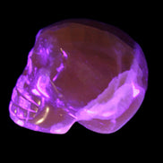 Honey Calcite skull from Pakistan 28*44*36mm 93g in UV light - Rocks and Things Store