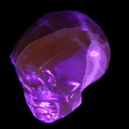 Honey Calcite skull from Pakistan 28*44*36mm 93g in UV light - Rocks and Things Store