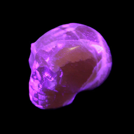 Honey Calcite skull from Pakistan 28*44*36mm 93g in UV light - Rocks and Things Store