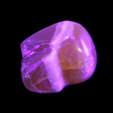 Honey Calcite skull from Pakistan 28*44*36mm 93g in UV light - Rocks and Things Store