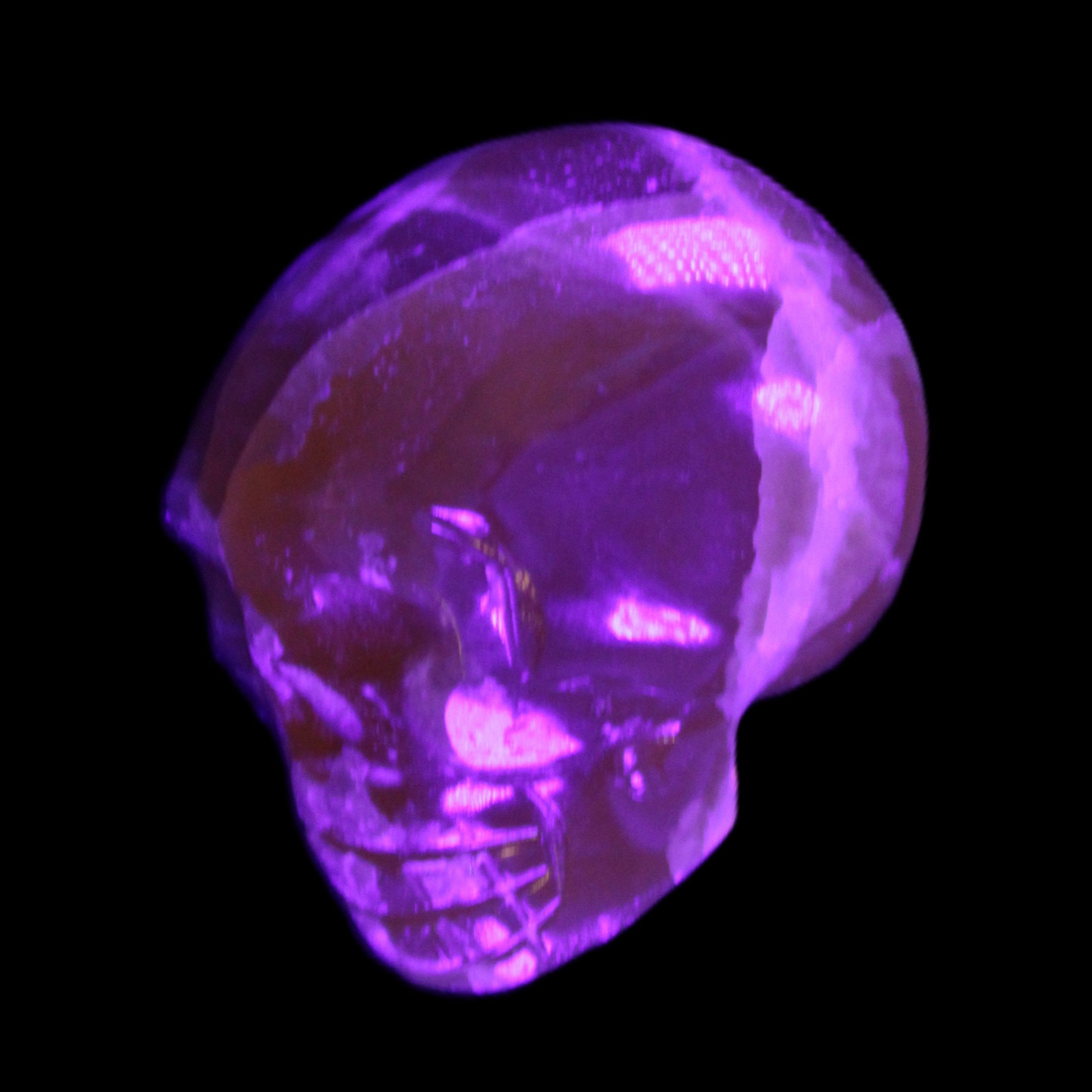 Honey Calcite skull from Pakistan 28*44*36mm 93g in UV light - Rocks and Things Store