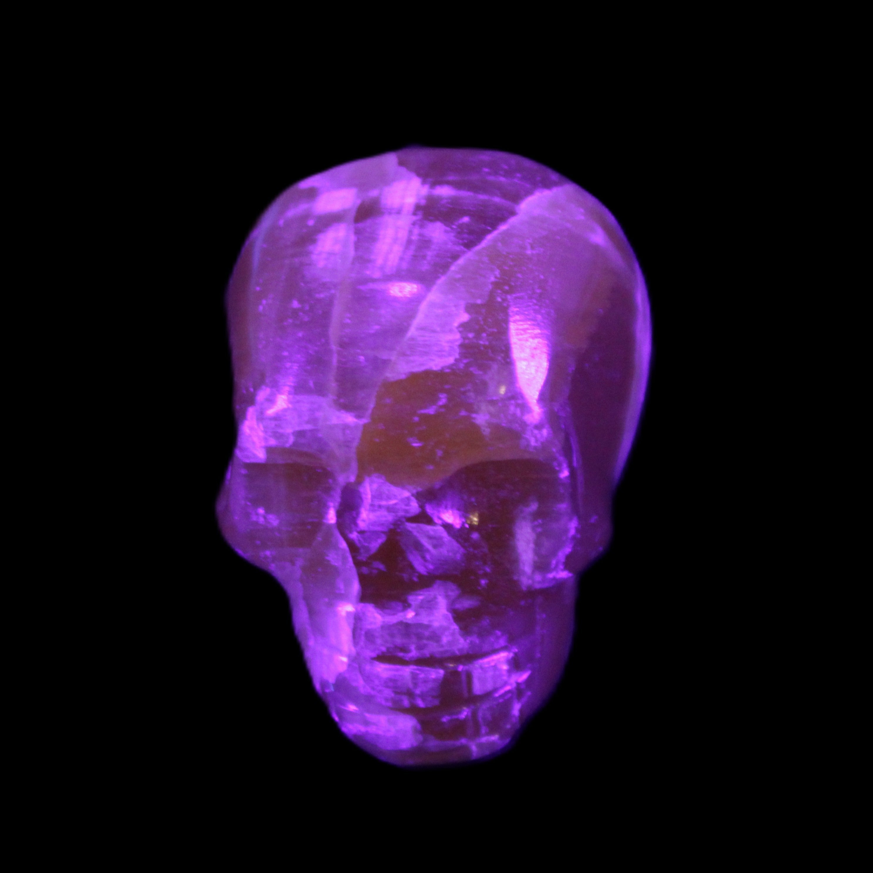 Honey Calcite skull from Pakistan 28*44*36mm 93g in UV light - Rocks and Things Store