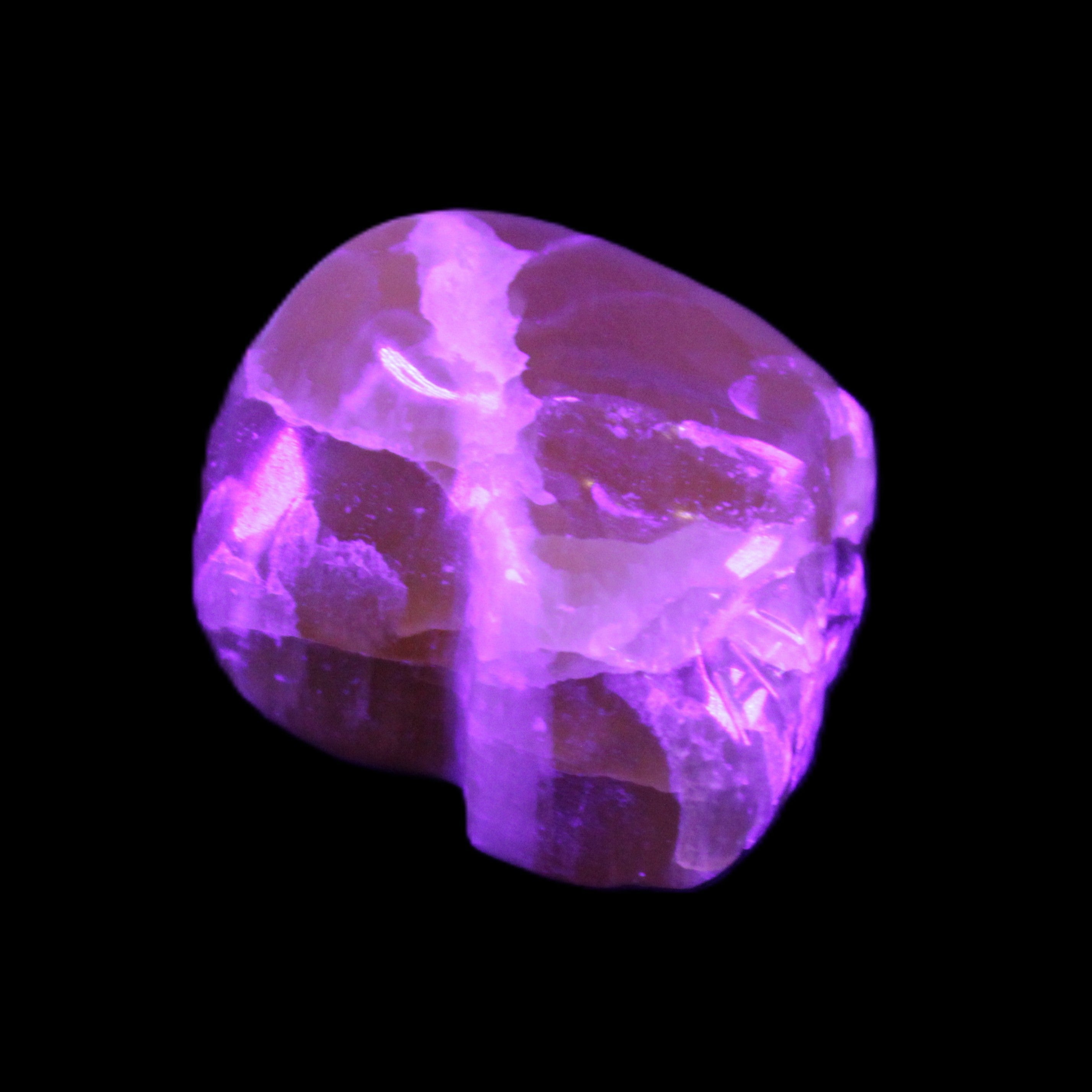 Honey Calcite skull from Pakistan 28*44*36mm 93g in UV light - Rocks and Things Store