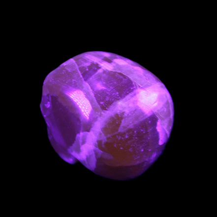 Honey Calcite skull from Pakistan 28*44*36mm 93g in UV light - Rocks and Things Store