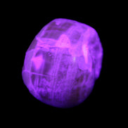 Honeycomb Calcite skull from Pakistan 28*38*34mm 62g in UV light - Rocks and Things Store