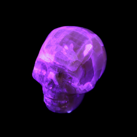 Honeycomb Calcite skull from Pakistan 28*38*34mm 62g in UV light - Rocks and Things Store