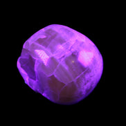 Honeycomb Calcite skull from Pakistan 28*38*34mm 62g in UV light - Rocks and Things Store