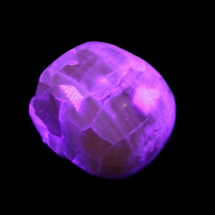 Honeycomb Calcite skull from Pakistan 28*38*34mm 62g in UV light - Rocks and Things Store