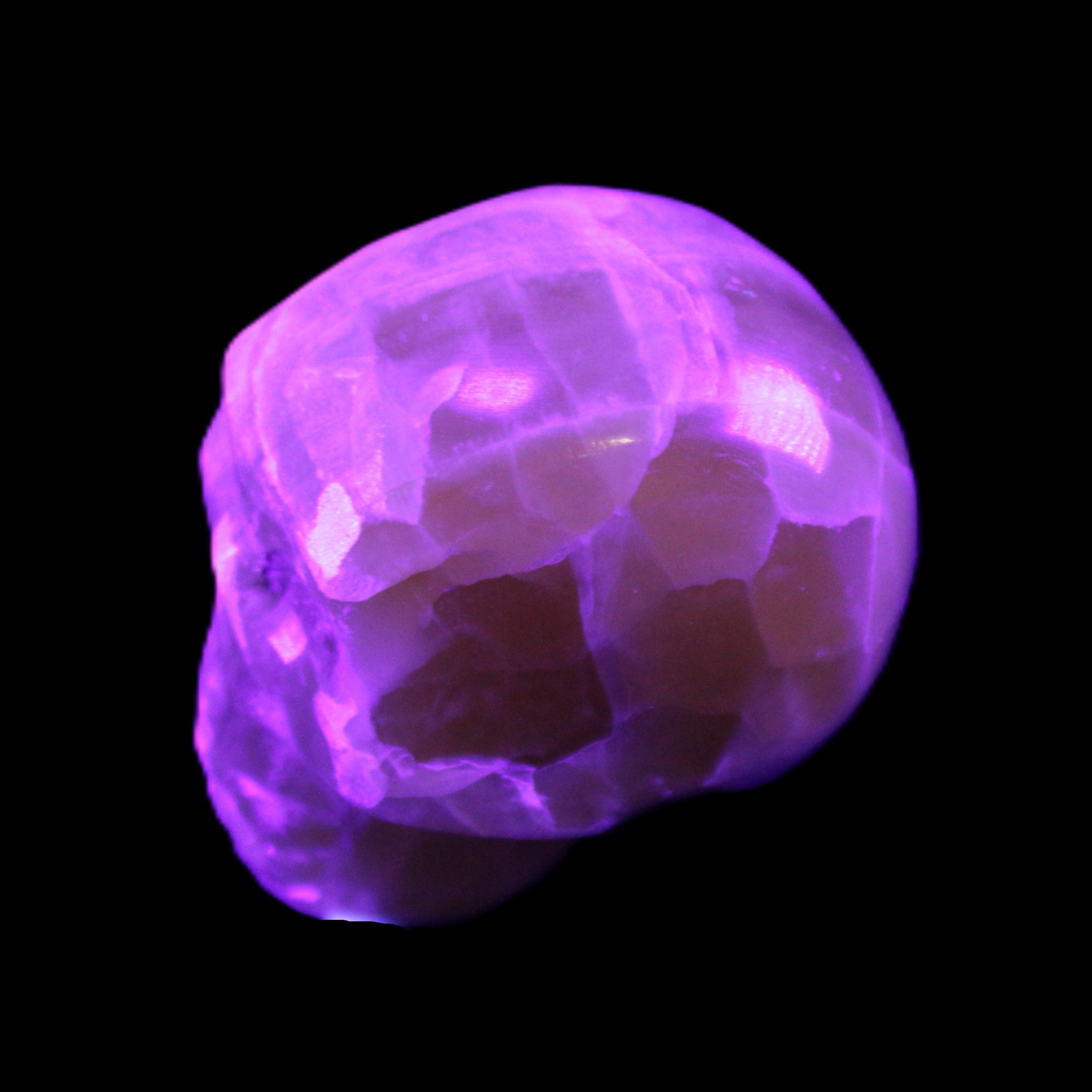 Honeycomb Calcite skull from Pakistan 28*38*34mm 62g in UV light - Rocks and Things Store